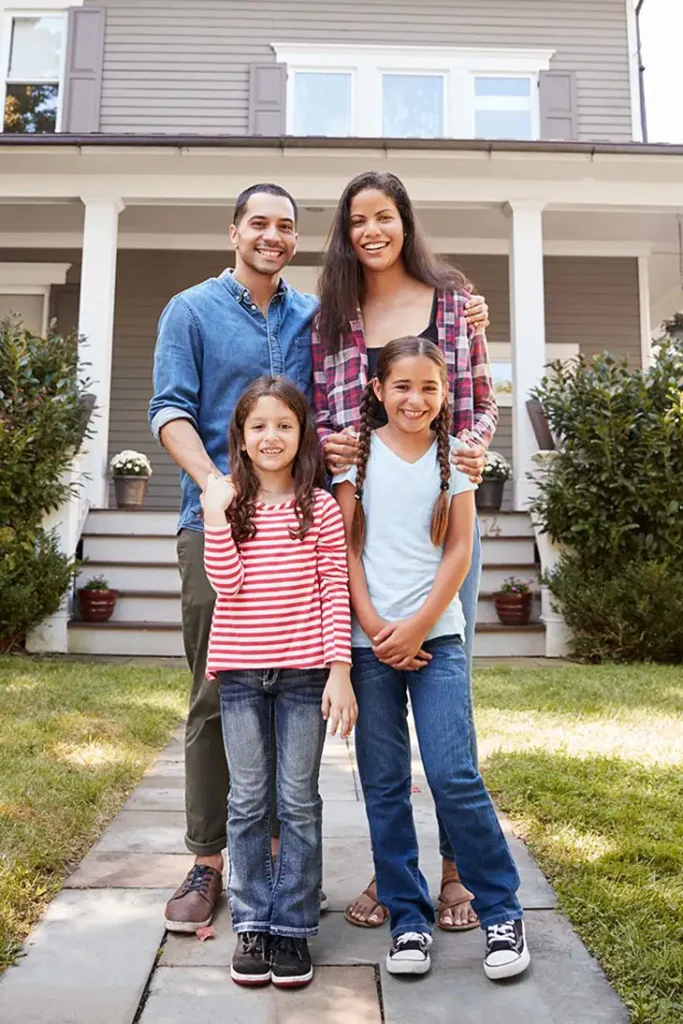 Happy family who just got a new roof.